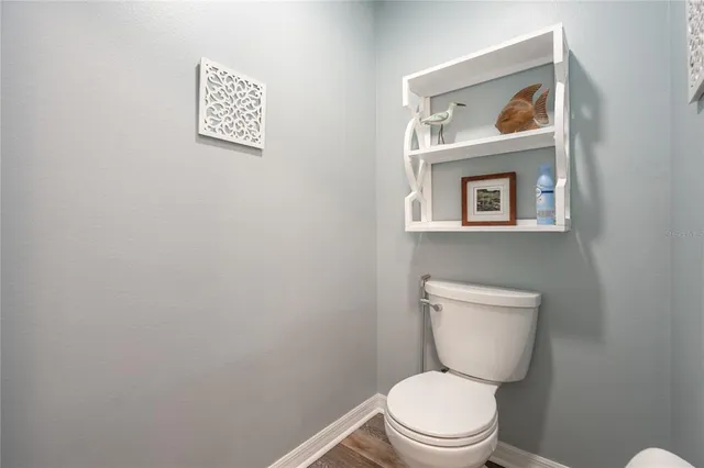 a view of a livingroom with workspace and a window