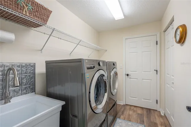 a view of a house with backyard sitting area and garden