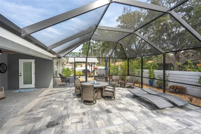 an aerial view of multiple houses with yard