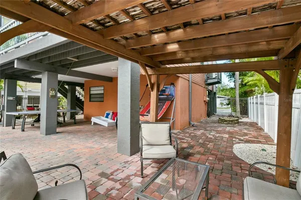 a view of a room with wooden floor and furniture