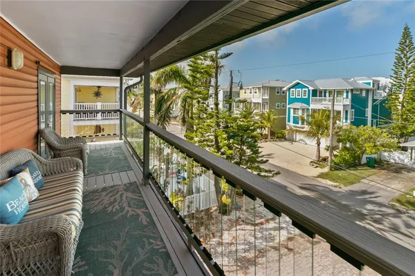 a view of balcony with furniture