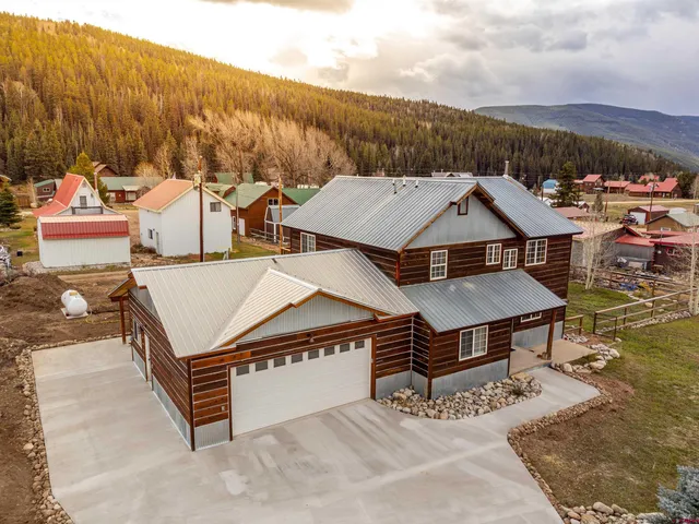 an aerial view of a house with roof deck