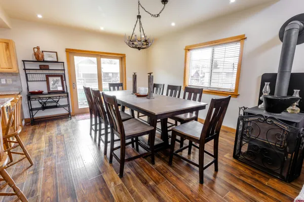 a kitchen with stainless steel appliances granite countertop a sink stove and wooden floor