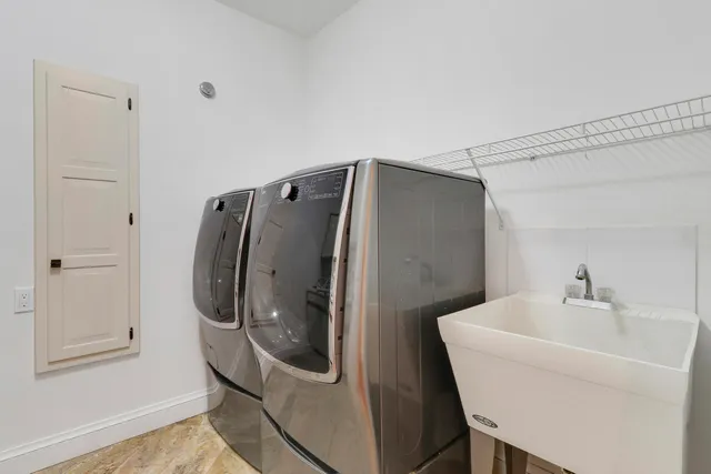 a bathroom with a sink a mirror and a shower