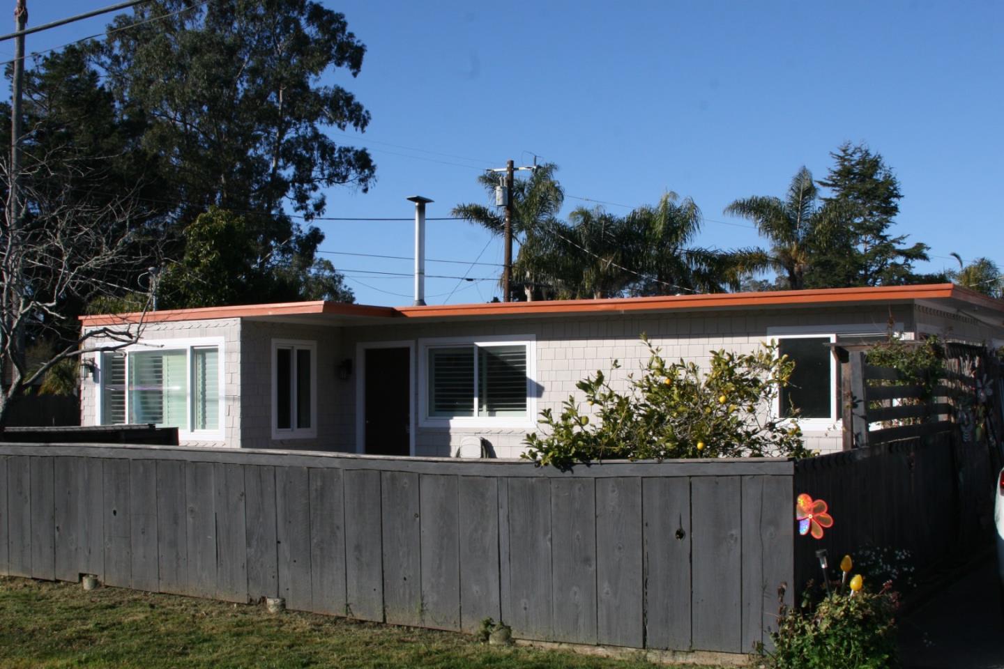 aerial view of a house with a yard