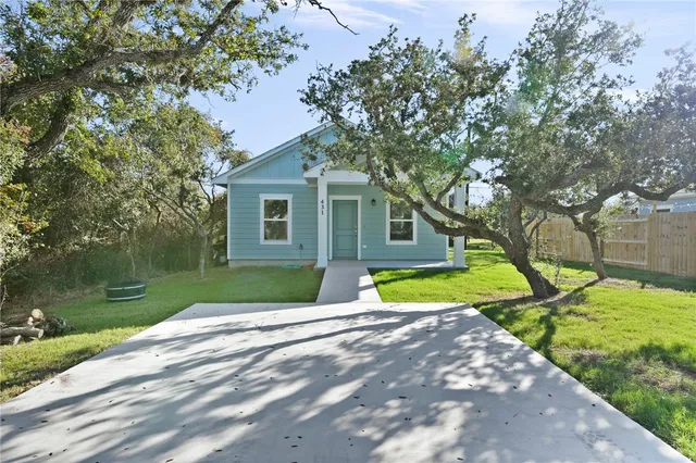 a view of house with outdoor space and swimming pool