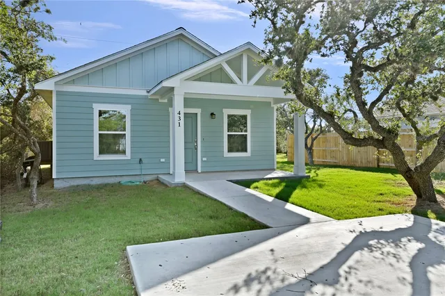 front view of a house with a yard