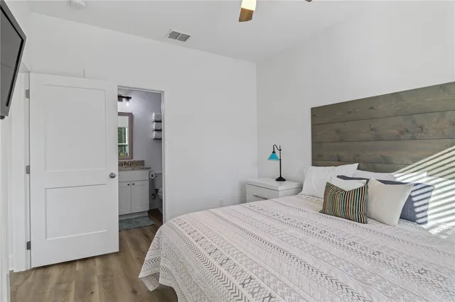 a bedroom with a bed and a table