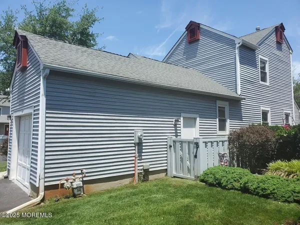 a view of a house with a yard and plants