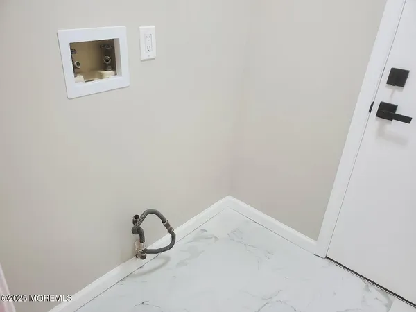 a view of a room with racks on the wall