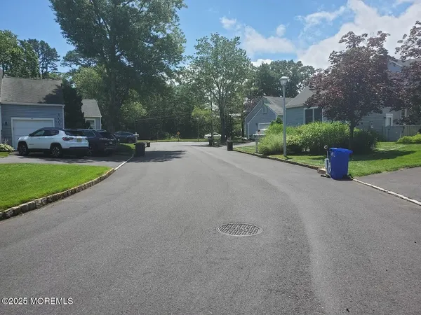 a view of a street with a house