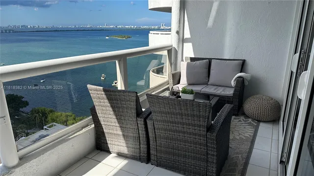 a view of balcony with furniture