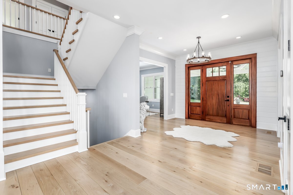 2 Pond View Lane Sherman, CT 06784 - Photo 13 of 40 a view of an entryway with wooden floor and door