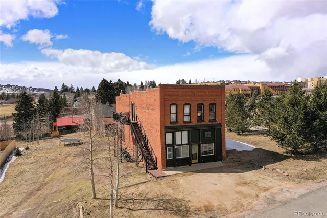 a view of a street with a building in the background