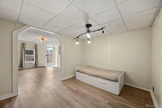 a living room with furniture and a ceiling fan