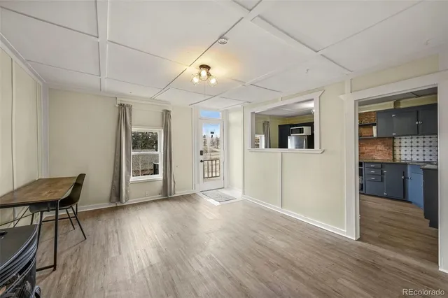 a view of a livingroom with furniture and wooden floor