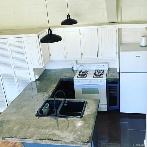 a kitchen with a sink and a window
