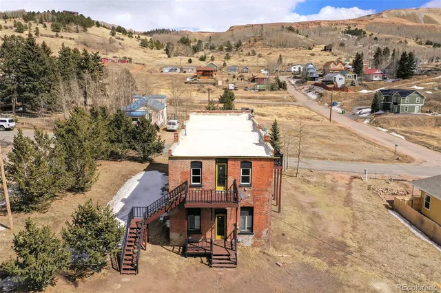 a bathroom with a toilet and a mirror