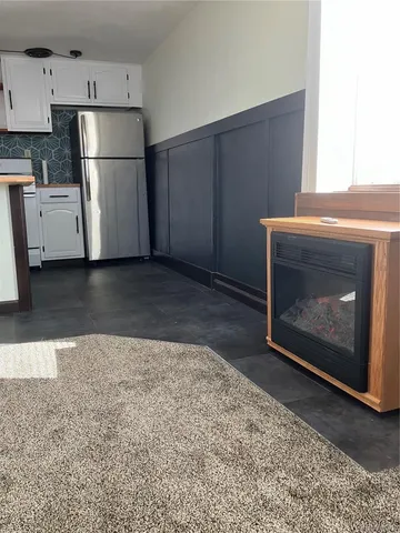 a view of a kitchen counter space and windows