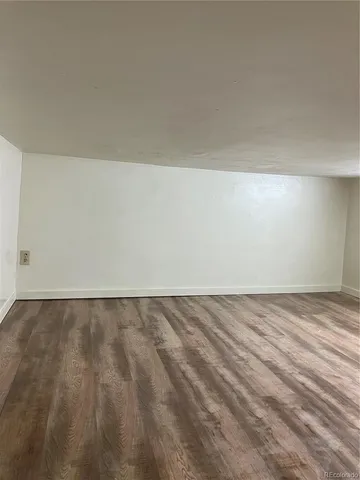 a bathroom with a granite countertop toilet sink and mirror