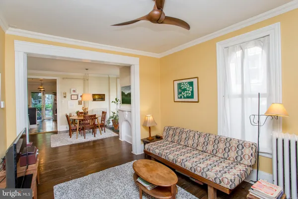 a kitchen with stainless steel appliances a sink a stove a refrigerator and cabinets