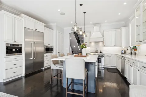 a view of staircase with railing and a window