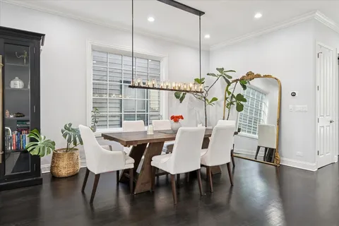 a bedroom with furniture a flat screen tv and a fireplace