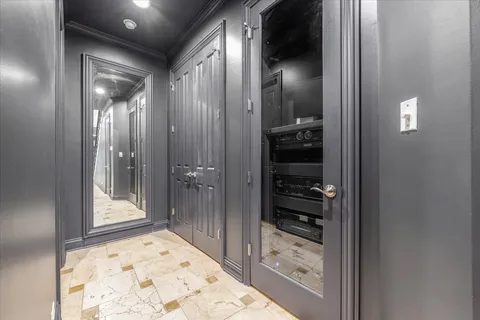 a bathroom with a granite countertop sink mirror vanity and toilet