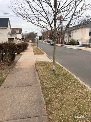 a view of a street with cars