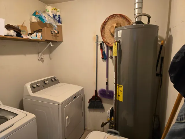 a kitchen with stainless steel appliances a refrigerator and cabinets