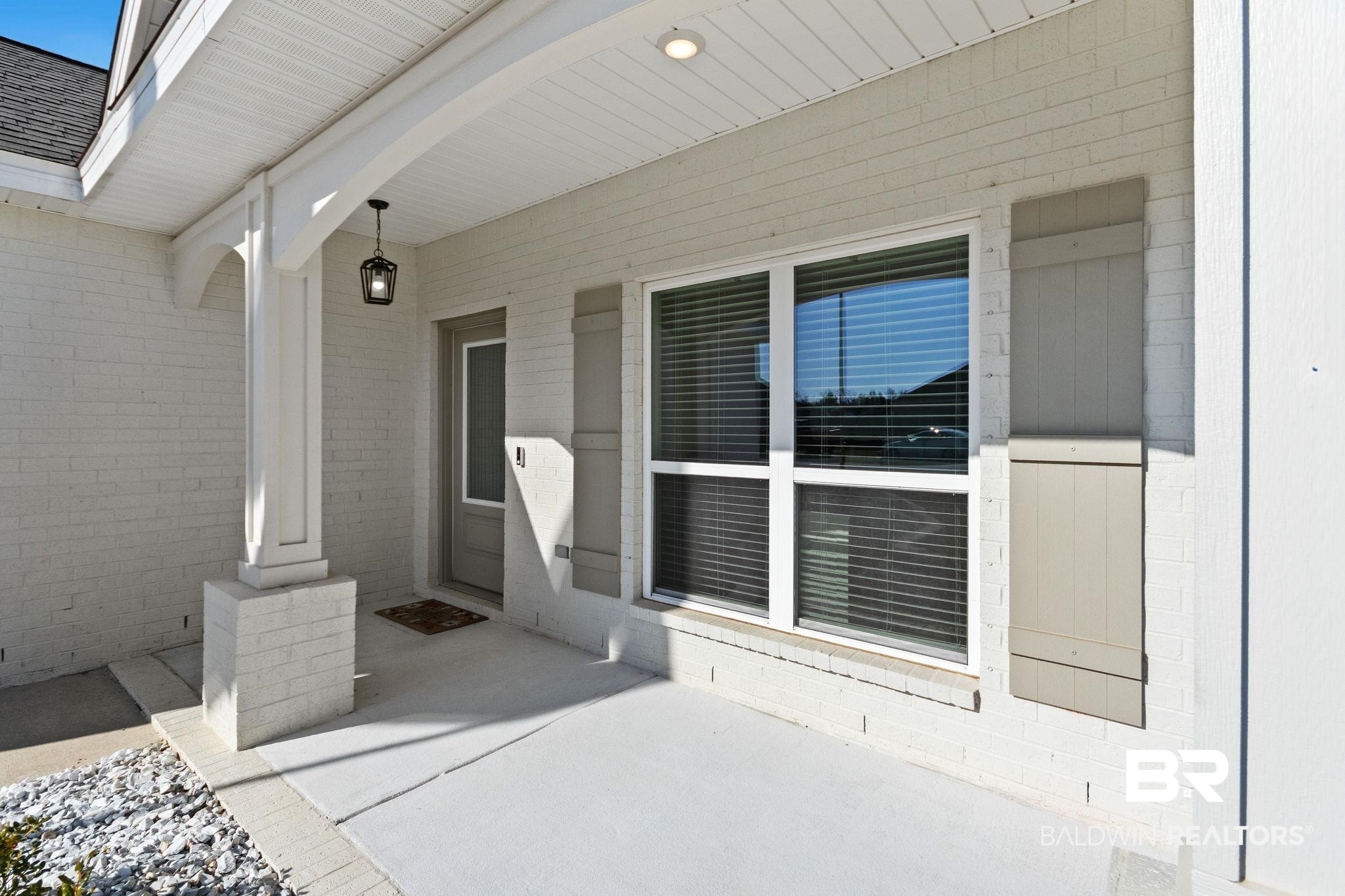 12919 Torrent Road Fairhope, AL 36532 - Photo 44 of 74 View of exterior entry featuring covered porch and brick siding