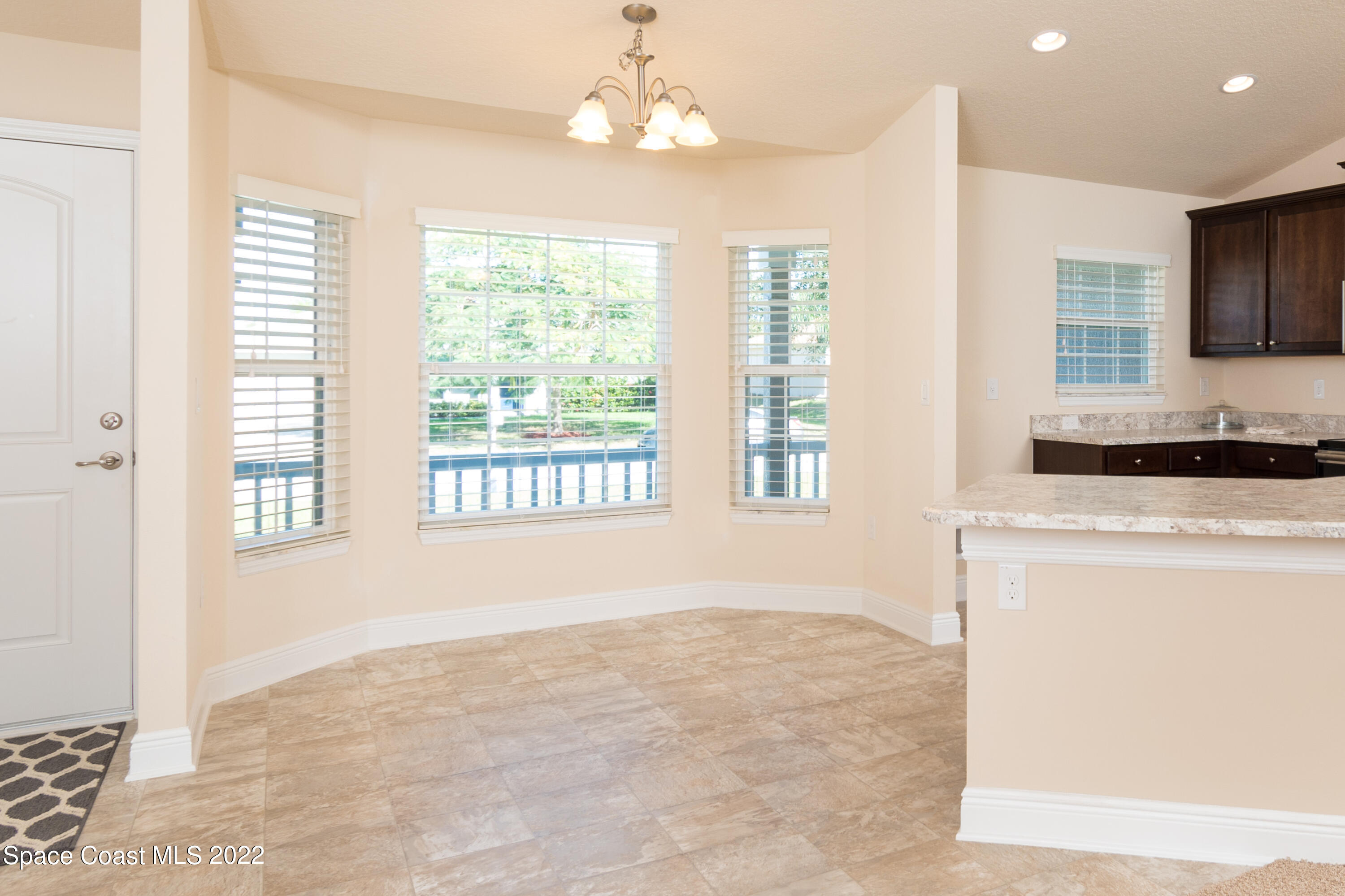 1490 Saxony Road Southwest Palm Bay, FL 32908 - Photo 6 of 15 a view of an empty room with a window