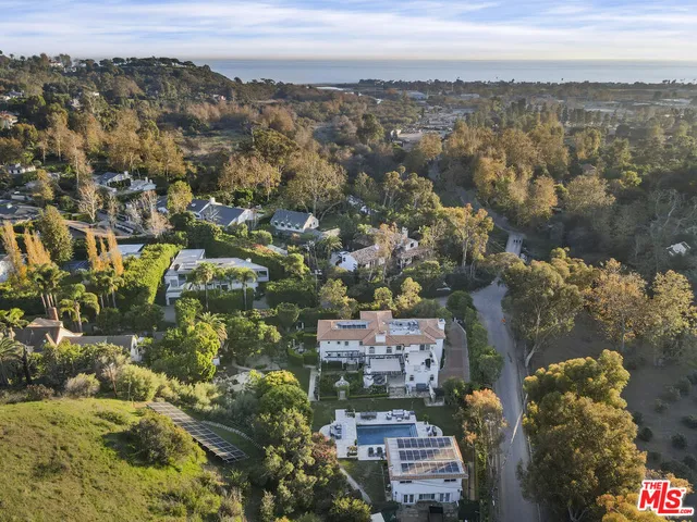 an aerial view of city and mountain