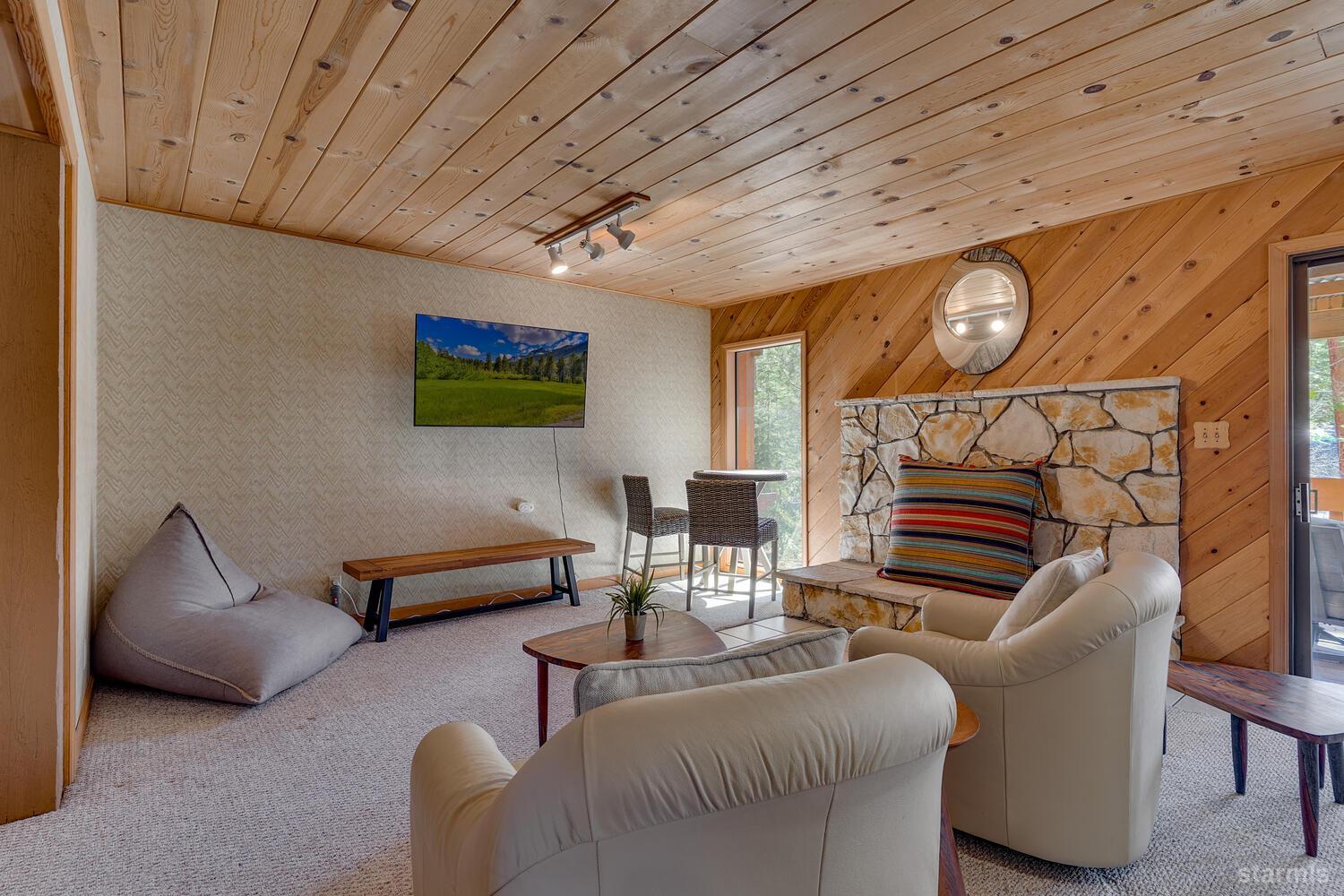 345 Granite Drive Stateline, NV 89449 - Photo 13 of 24 a living room with furniture and a flat screen tv