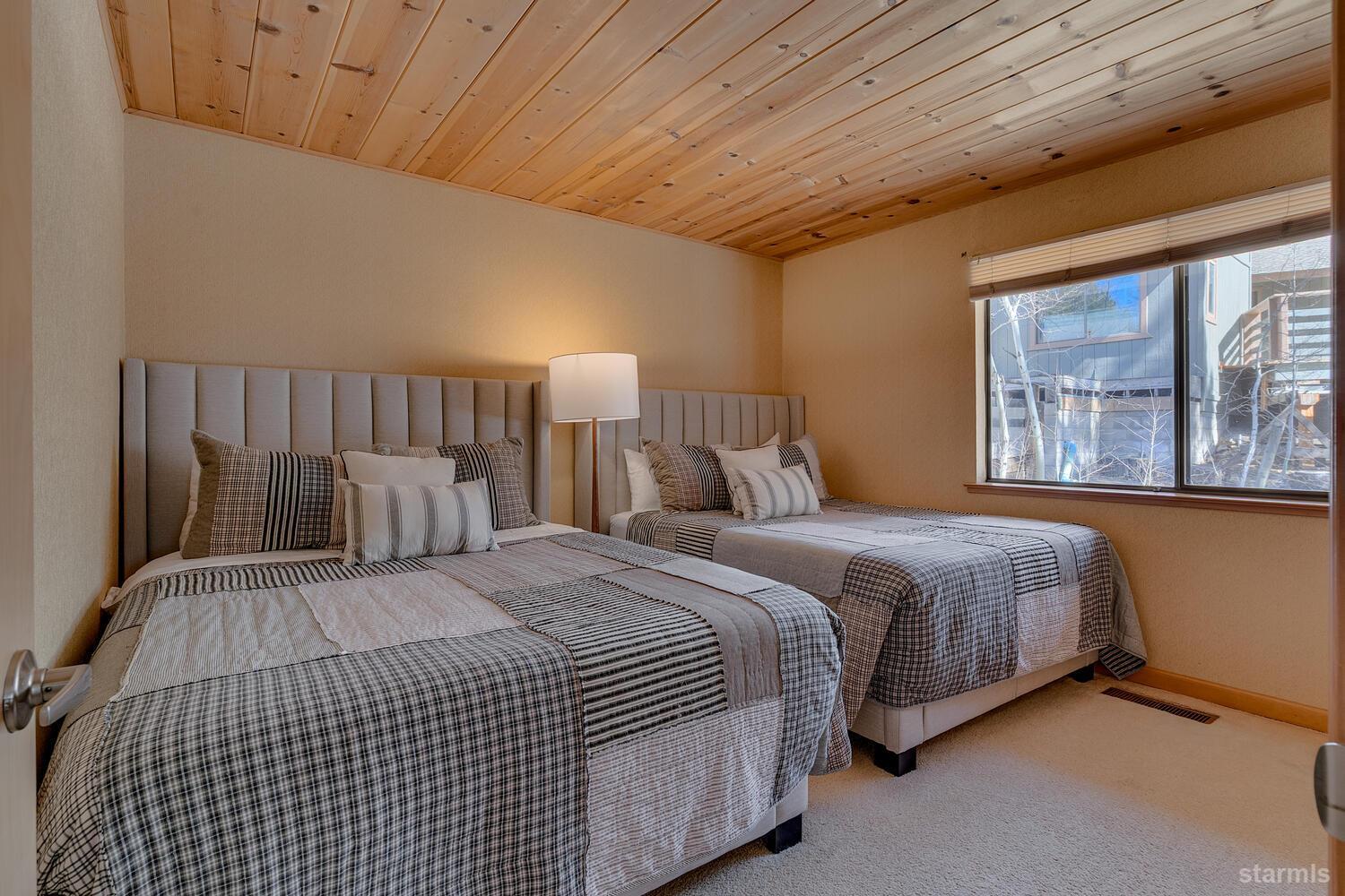345 Granite Drive Stateline, NV 89449 - Photo 14 of 24 a bedroom with a bed and a night stand