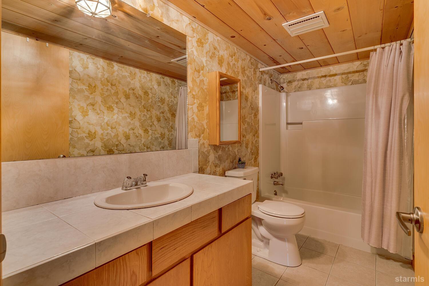 345 Granite Drive Stateline, NV 89449 - Photo 16 of 24 a bathroom with a sink toilet and shower