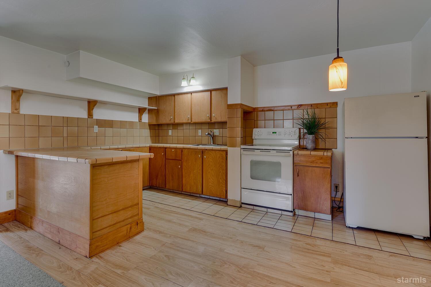 345 Granite Drive Stateline, NV 89449 - Photo 18 of 24 a kitchen with kitchen island a sink stainless steel appliances and cabinets