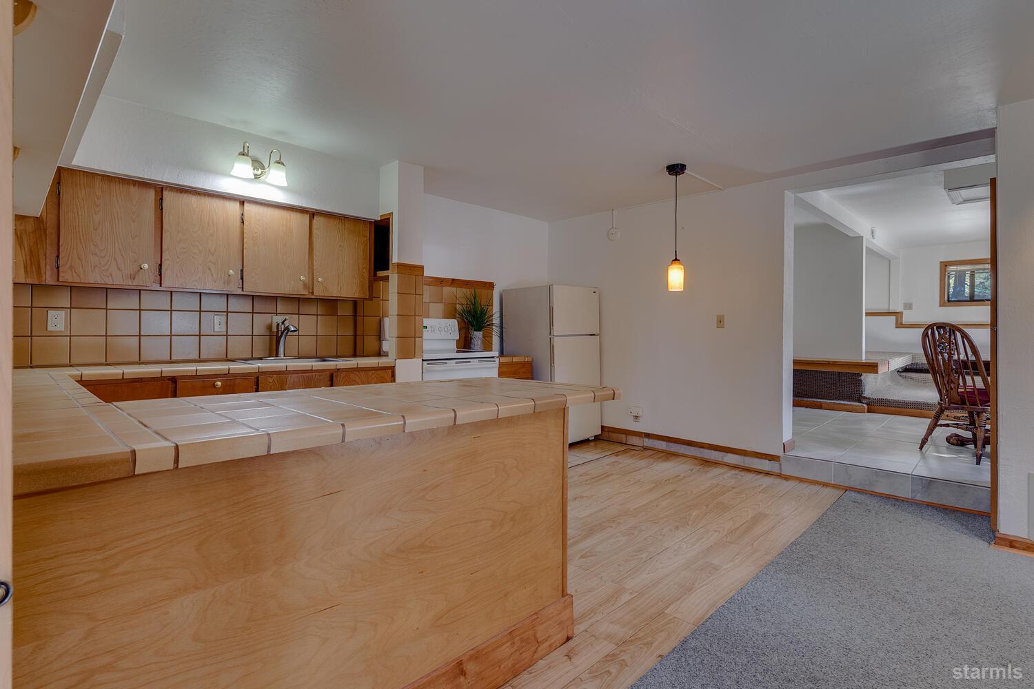 345 Granite Drive Stateline, NV 89449 - Photo 19 of 24 a view of a living room and kitchen with furniture