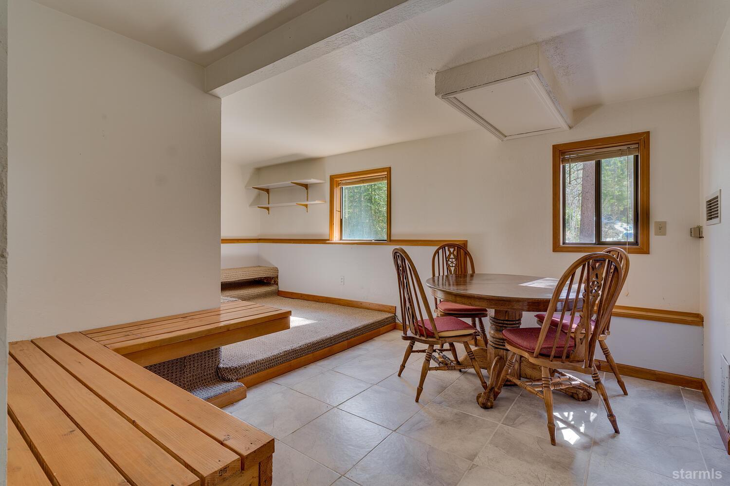 345 Granite Drive Stateline, NV 89449 - Photo 20 of 24 a view of a dining room with furniture and window