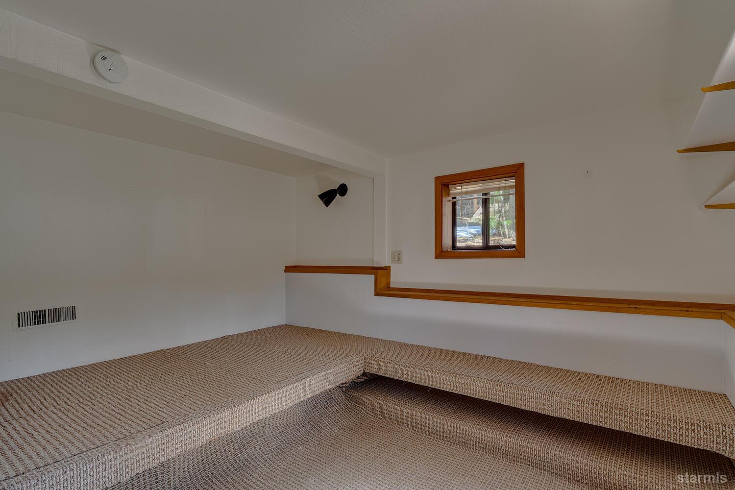 345 Granite Drive Stateline, NV 89449 - Photo 22 of 24 a hallway with a bed and a potted plant