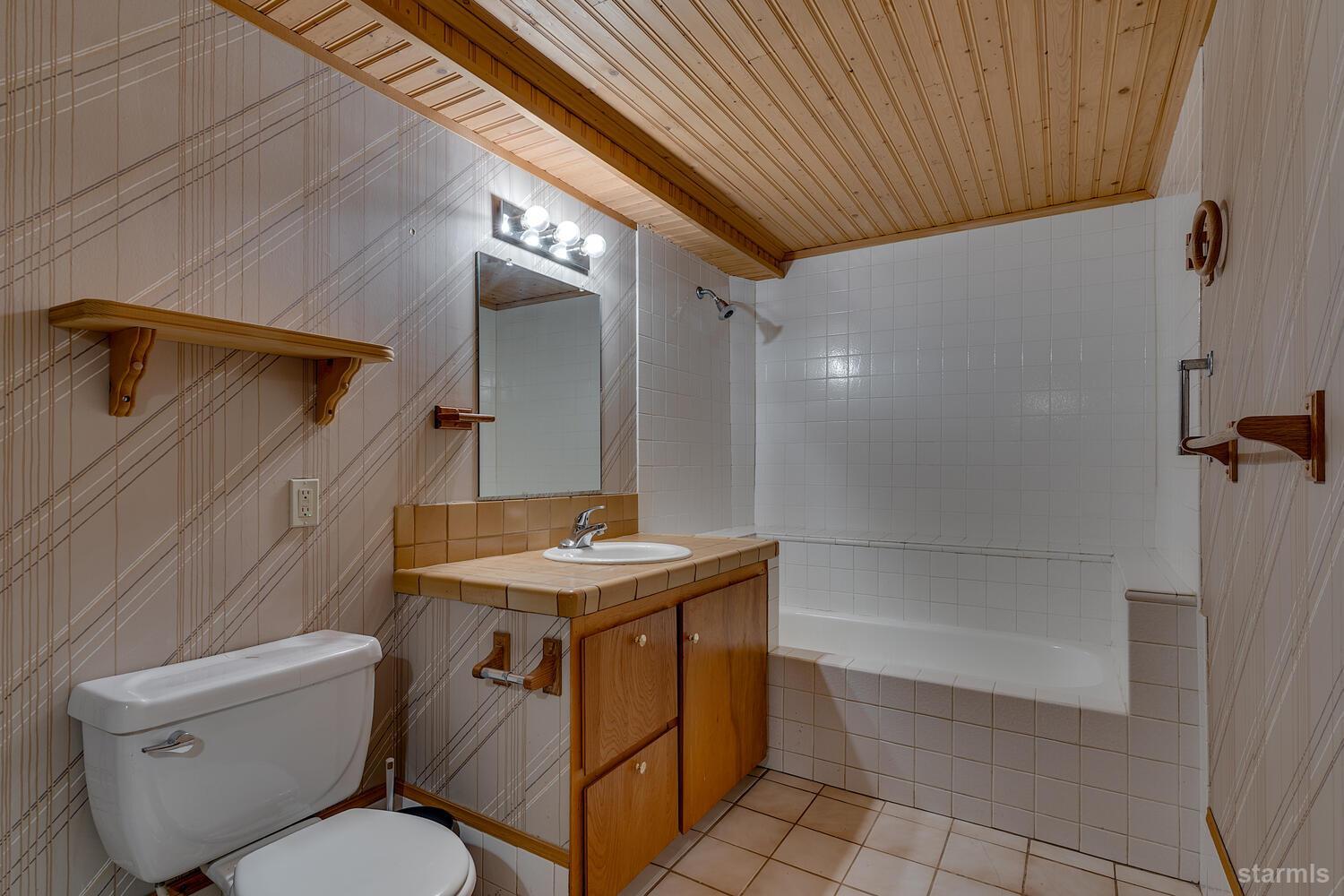 345 Granite Drive Stateline, NV 89449 - Photo 23 of 24 a bathroom with a toilet sink and shower