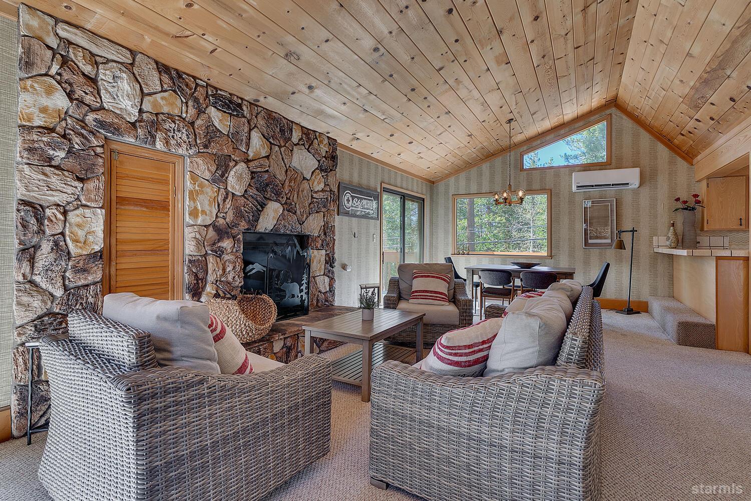 345 Granite Drive Stateline, NV 89449 - Photo 6 of 24 a living room with fireplace furniture and a large window