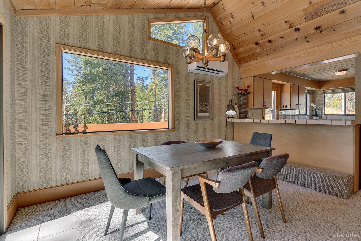 345 Granite Drive Stateline, NV 89449 - Photo 8 of 24 a view of a dining room with furniture window and outside view