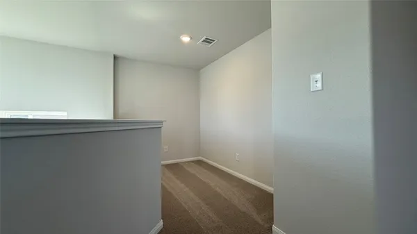 a view of a backyard with wooden fence