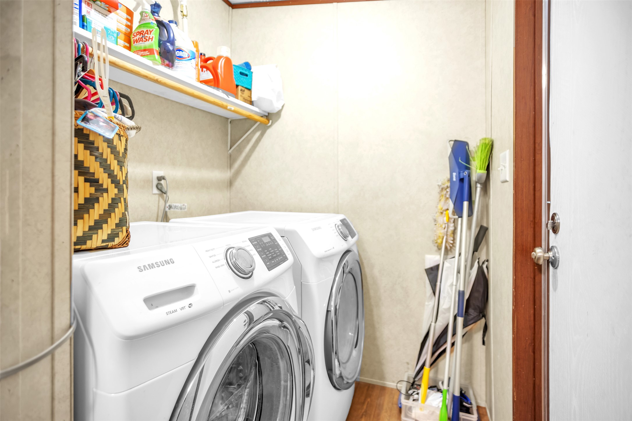 363 El Rey Drive Kyle, TX 78640 - Photo 25 of 40 Laundry room with separate washer and dryer and wood finished floors