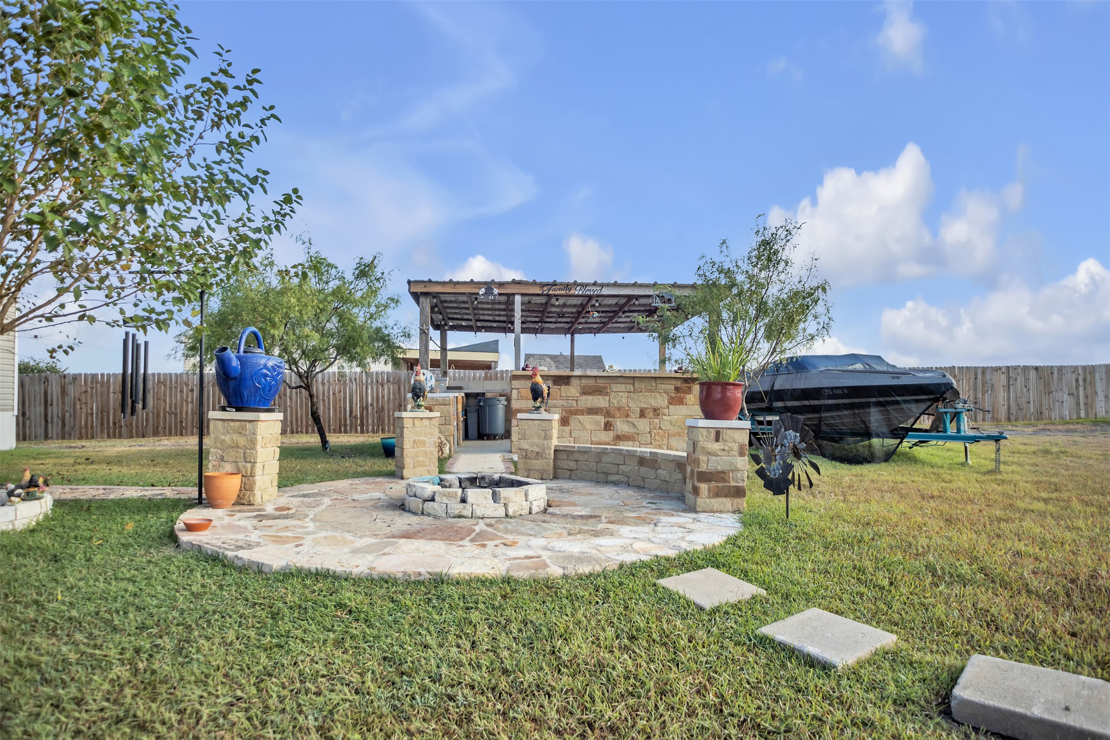 363 El Rey Drive Kyle, TX 78640 - Photo 32 of 40 Fenced backyard featuring a patio, an outdoor fire pit, and a pergola