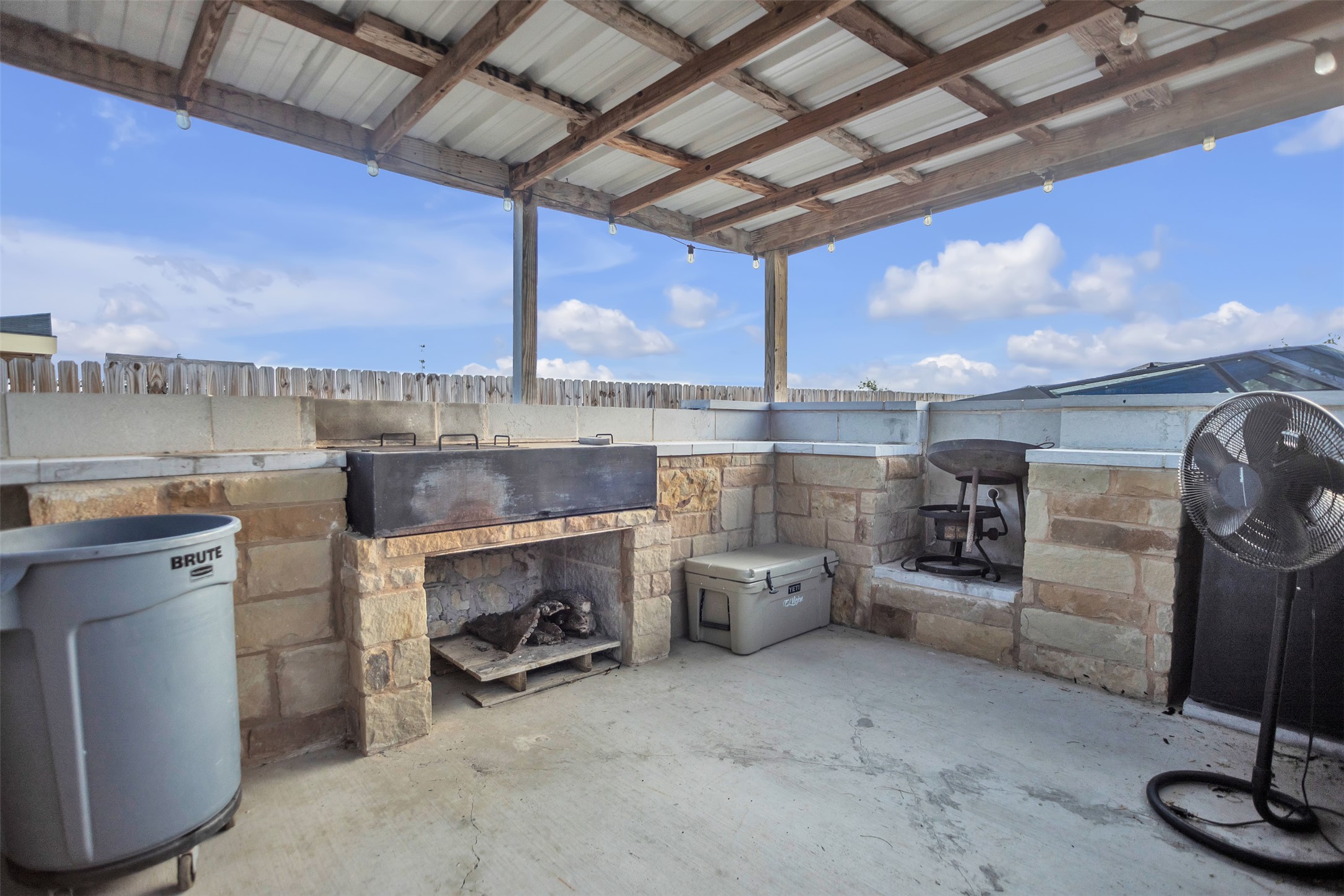 363 El Rey Drive Kyle, TX 78640 - Photo 34 of 40 View of patio with an outdoor stone fireplace and grilling area