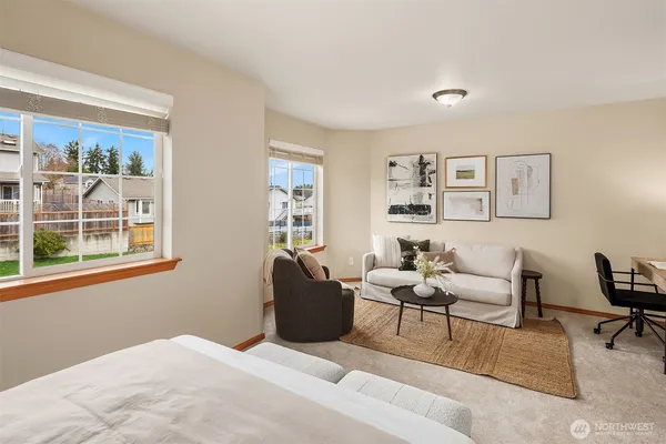 a bedroom with furniture and a window