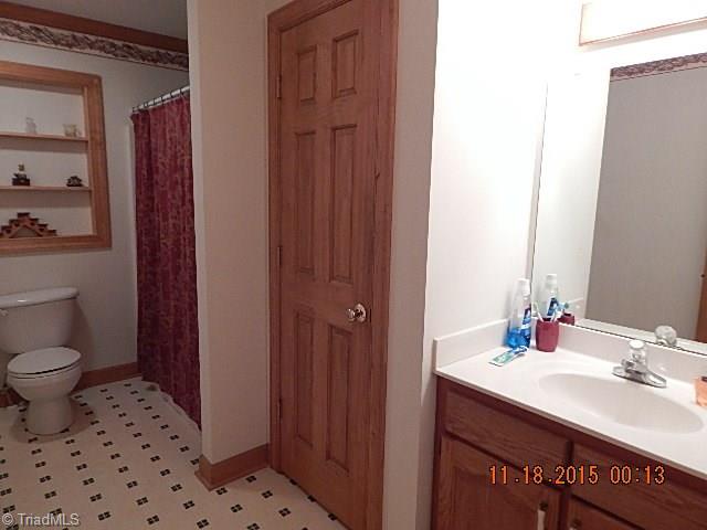 1077 Slate Road King, NC 27021 - Photo 15 of 30 The guest bath has linen closet.