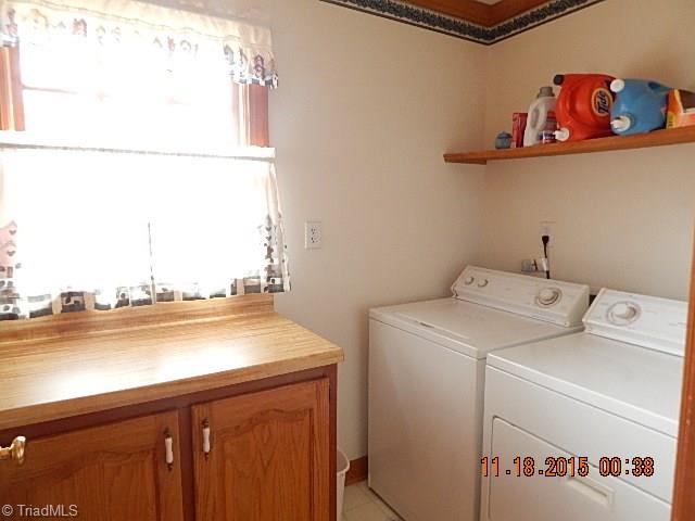 1077 Slate Road King, NC 27021 - Photo 28 of 30 Folding counter in laundry plus storage.